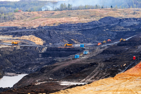 open mining pit with heavy machineryの写真素材