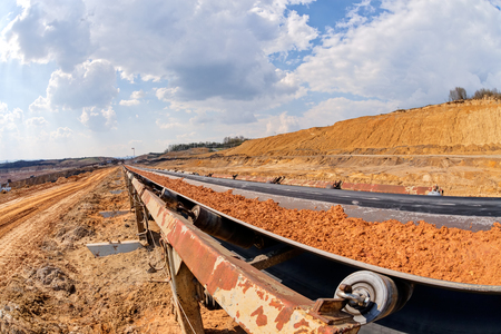 open mining pit with heavy machineryの写真素材