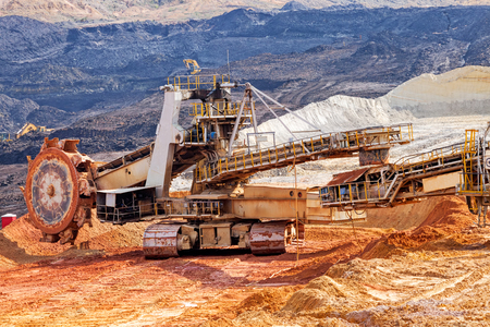 open mining pit with heavy machineryの写真素材