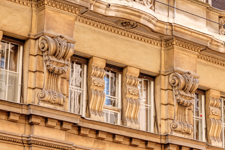 stone facade on classical building with ornaments and sculpturesの写真素材