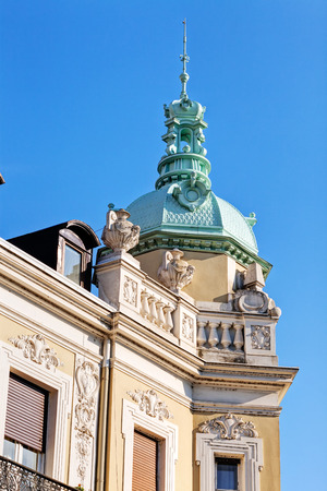 Stone facade on classical building with ornaments and sculpturesの写真素材