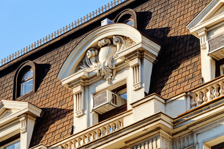 stone facade on classical building with ornaments and sculpturesの写真素材