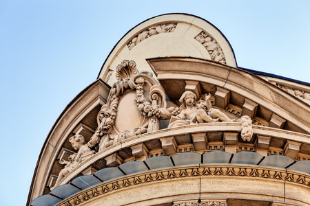 stone facade on classical building with ornaments and sculpturesの写真素材