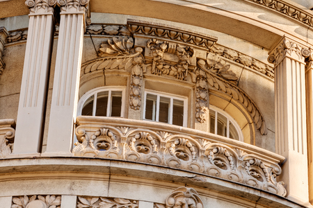 stone facade on classical building with ornaments and sculpturesの写真素材