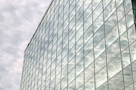 Detail of modern building  glass facade with reflectionsの写真素材