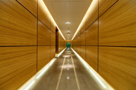 Corridor inside of modern building with wooden panels on wallsの写真素材