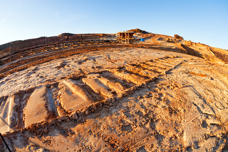 open mining pit with heavy machineryの写真素材