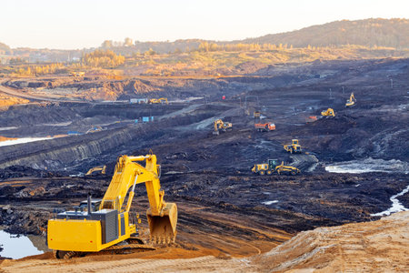 open mining pit with heavy machinery
