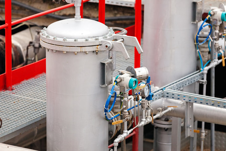 detail of oil pipeline with valves in large oil refineryの写真素材