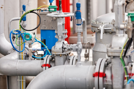detail of oil pipeline with valves in large oil refineryの写真素材