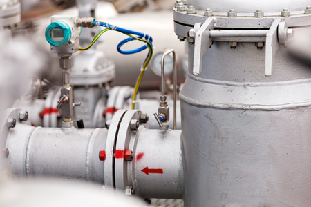 detail of oil pipeline with valves in large oil refineryの写真素材