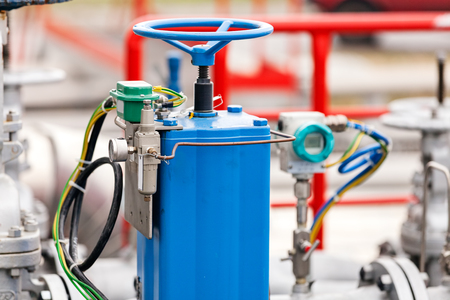 detail of oil pipeline with valves in large oil refineryの写真素材
