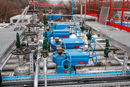 detail of oil pipeline with valves in large oil refineryの写真素材