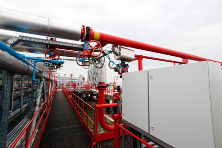 detail of oil pipeline with valves in large oil refineryの写真素材