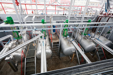 detail of oil pipeline with valves in large oil refineryの写真素材