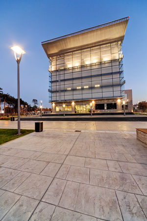 Modern building exterior with glass and metallic facadeの写真素材