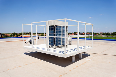 Flat roof with skylight, climatization wquipment and hydro insulation membranesの写真素材