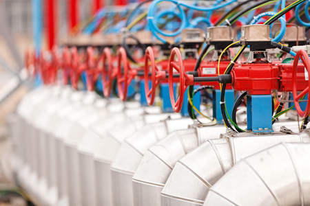 detail of oil pipeline with valves in large oil refineryの写真素材