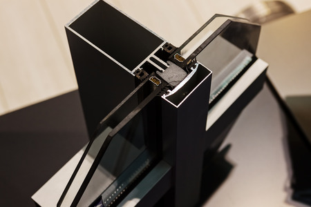 Cut of the window profile with metal, glass and insulationの写真素材