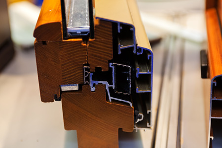 Cut of the window profile with metal, glass and insulationの写真素材