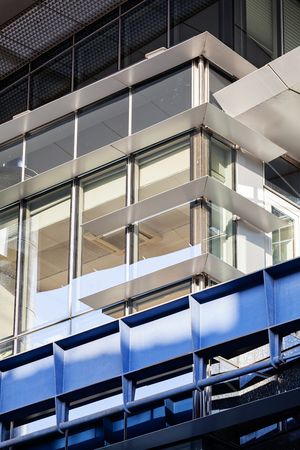 Modern building exterior with glass and metallic facadeの写真素材