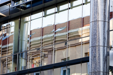 Modern building exterior with glass and metallic facadeの写真素材