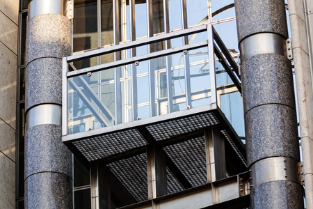 Modern building exterior with glass and metallic facadeの写真素材