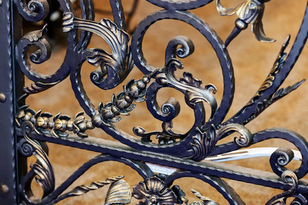 Details, structure and ornaments of wrought iron fence with gate