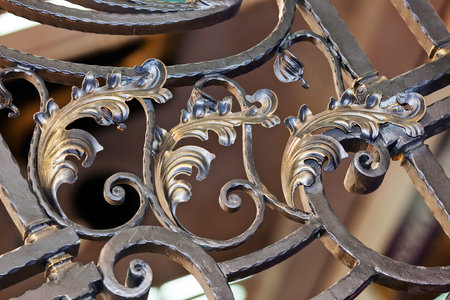 Details, structure and ornaments of wrought iron fence with gate