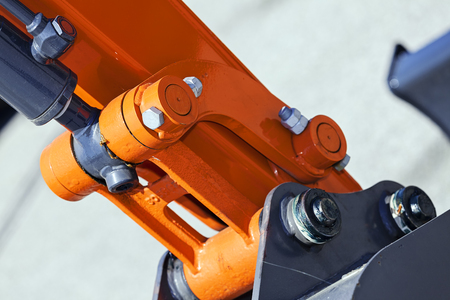 View on detail of new excavator digging; note shallow depth of fieldの写真素材