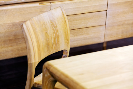 Wooden chair detail in small living roomの写真素材