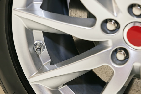 Steel detail inside of car wheel; note shallow depth of fieldの写真素材