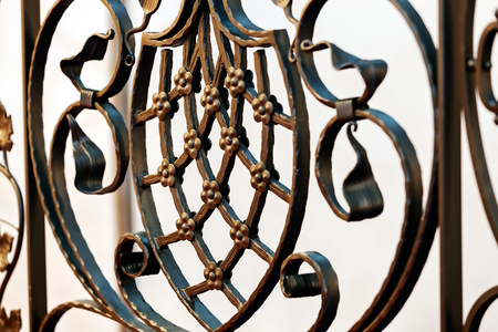 Details, structure and ornaments of wrought iron fence with gateの写真素材