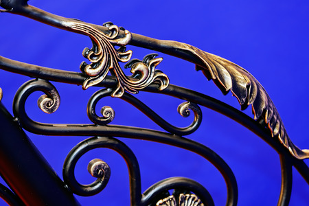 Details, structure and ornaments of wrought iron fence with gateの写真素材