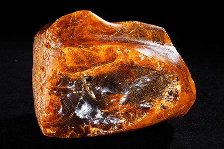 Baltic amber isolated on black bakgroundの写真素材