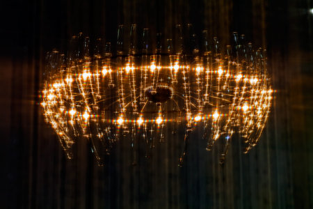 a large chandelier on the dark background, note shallow dept of field