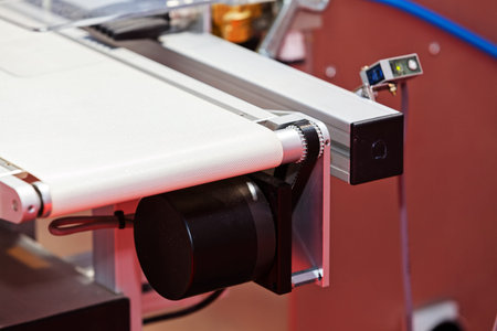 Closeup conveyor belt on the machine with protection; note shallow depth of fieldの写真素材