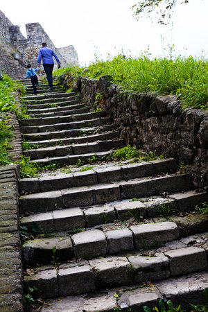 Old stone stairs with man and a boy on top