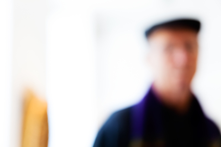 Blurred portrait of a man with a hat on white background; blurred 100%の写真素材
