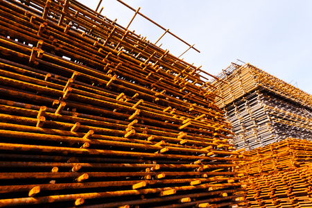 Rusty steel frames on construction site, sky in backgroundの写真素材