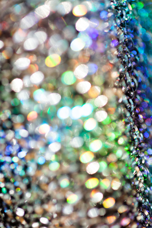 reflections of light multi color on the rough metal surface, for blurred backgroundの写真素材