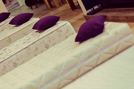 exhibit the pattern of the mattress to the bed, note shallow depth of fieldの写真素材