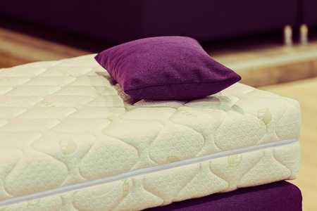 exhibit the pattern of the mattress to the bed, note shallow depth of fieldの写真素材