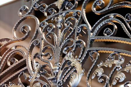 Details, structure and ornaments of wrought iron fence with gateの写真素材