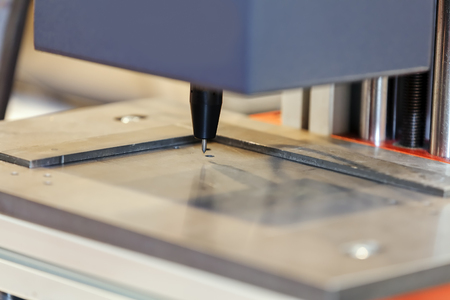 Laser machine for manufacture in industry advanced technology; note shallow depth of fieldの写真素材