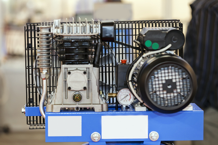 One detail and part of car engine with fence; note shallow depth of fieldの写真素材