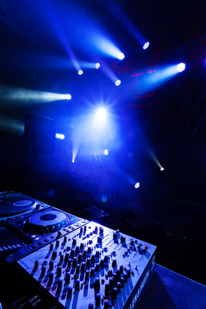 Dj mixer with laser in the background, at outdoors concertの写真素材
