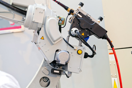 Robotic machine tool for industrial manufacture factory; note shallow depth of fieldの写真素材