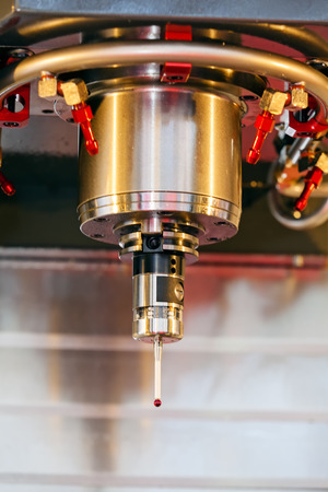 Detail of laser cutting machine head, advanced technology; note shallow depth of fieldの写真素材