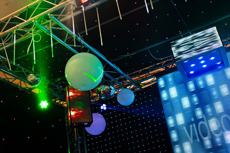 Green spotlight and video beam in a concertの写真素材